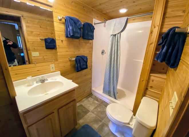 Bathroom with an oversized shower stall.