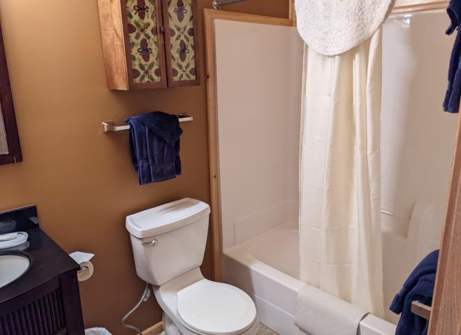 Upstairs bathroom with a standard tub/shower.