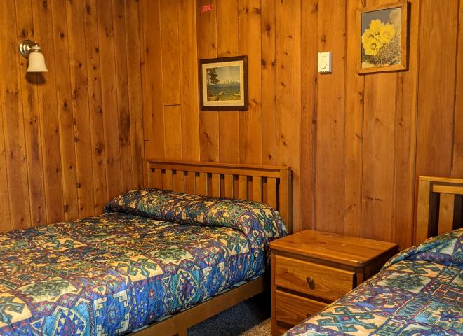Bedroom with a full size bed and twin.