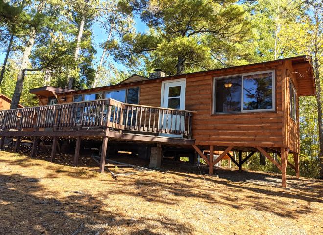 Exterior of Sunset View, nestled in the pines and views of the lake.