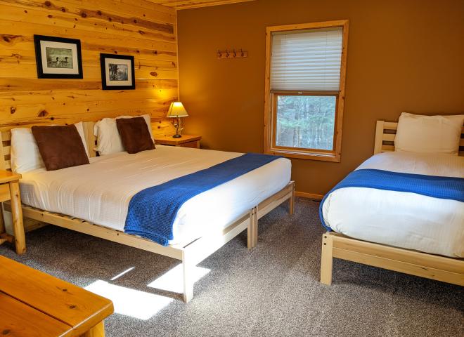 Master bedroom with a king, twin, and ensuite bathroom.