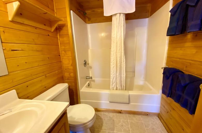 Bathroom with a standard tub/shower.