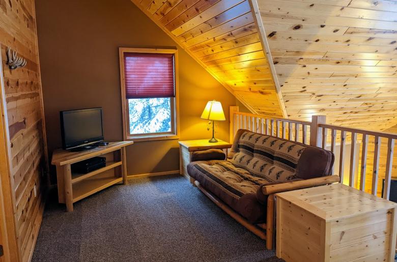Loft area with a futon.