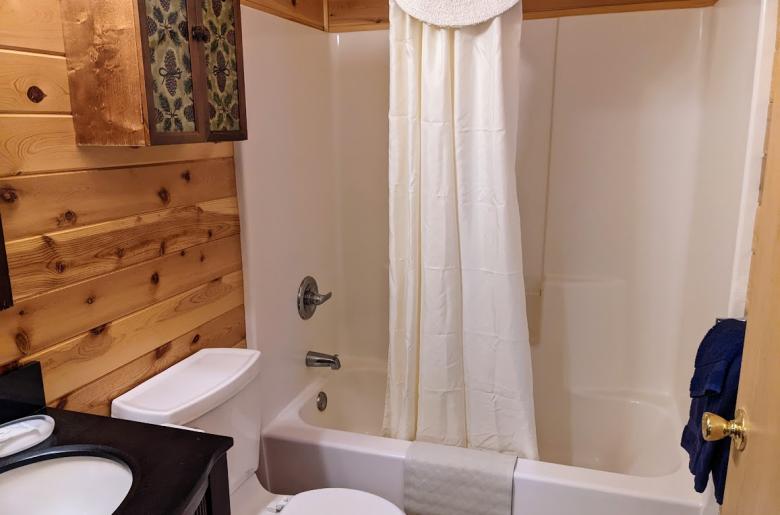 Master bathroom with a standard tub/shower.