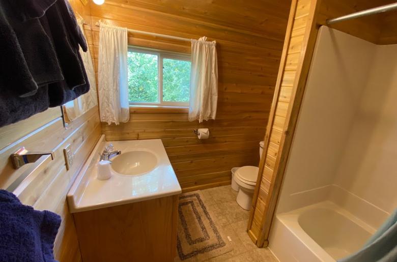 Upstairs bathroom with a standard tub/shower.