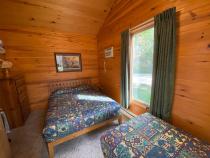 Bedroom with a queen and twin bed.
