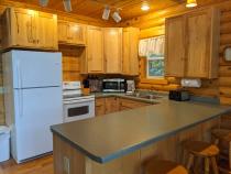 Kitchen with refrigerator, stove, and dishwasher.