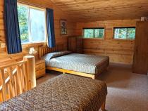 Upstairs bedroom with a queen, twin, and ensuite bathroom.